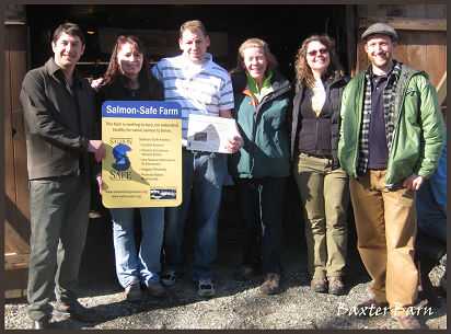 Group photo presenting award to Baxter Barn