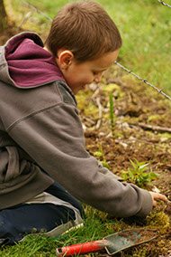 Child gardening at Baxter Barn