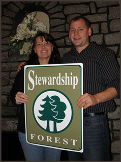 Stewardship Forest award being presented to Cory